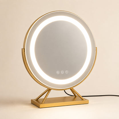 Gold round lighted vanity mirror with a rectangular base