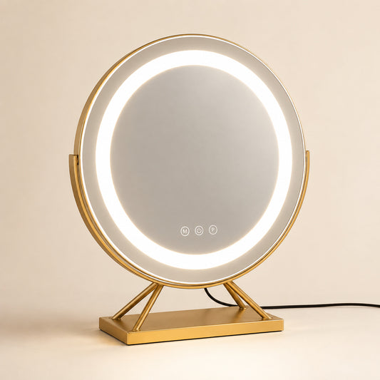 Gold round lighted vanity mirror with a rectangular base