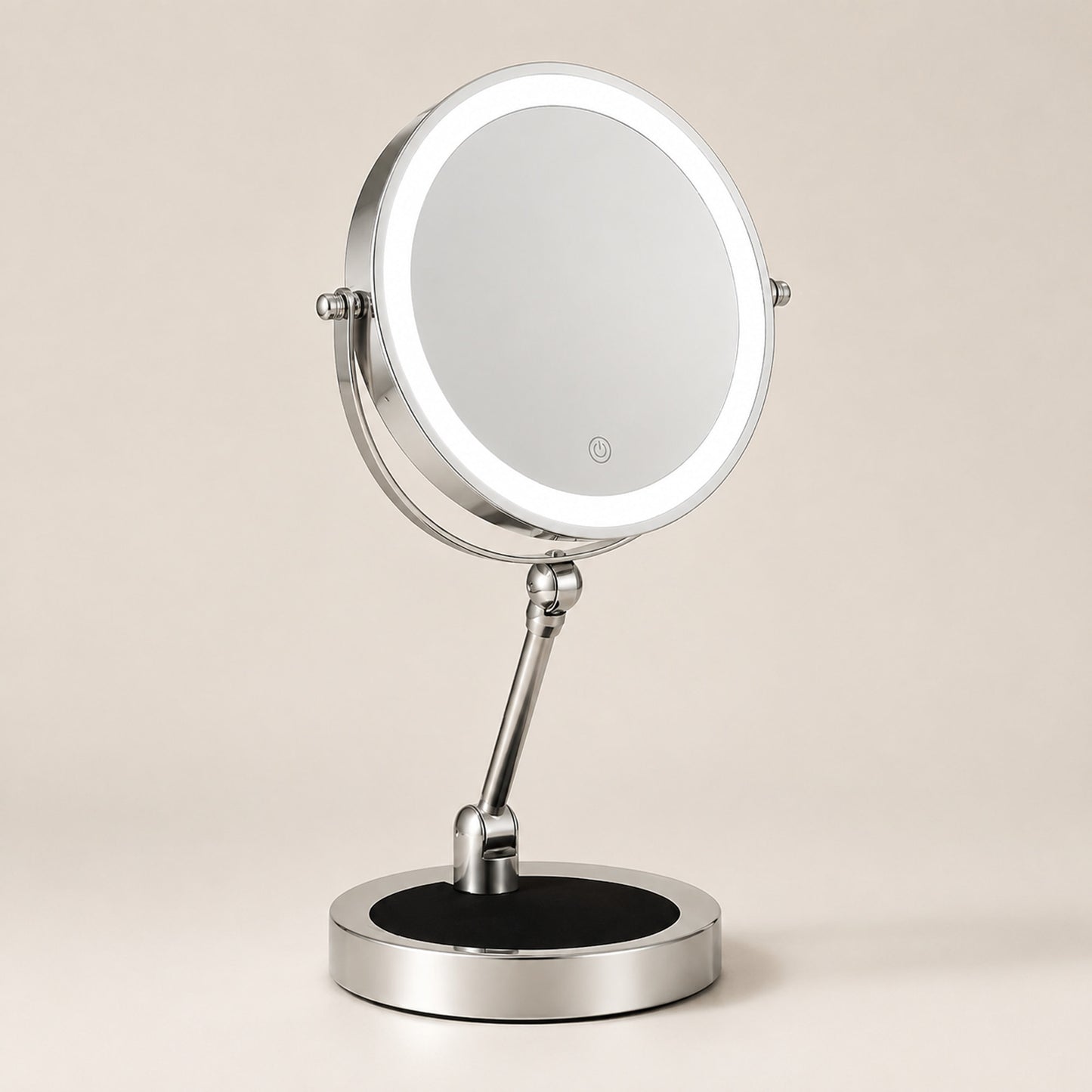 Silver lighted tabletop makeup mirror on a warm ivory background