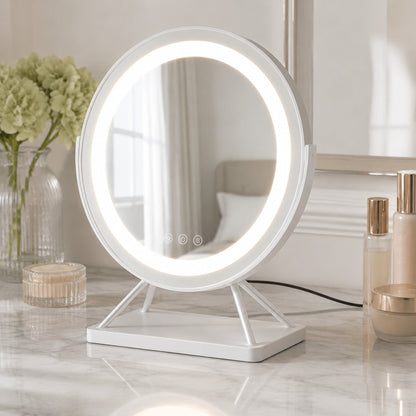 White round lighted vanity mirror in a bright dressing area