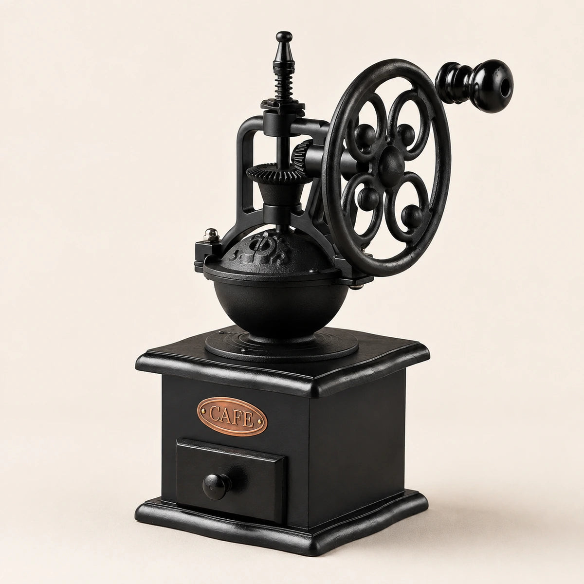 Heritage hand-crank coffee grinder with ceramic burr on an ivory background