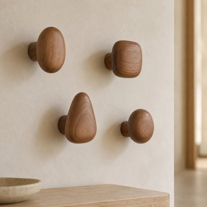 Walnut Wood pebble wall hooks in a warm modern hallway