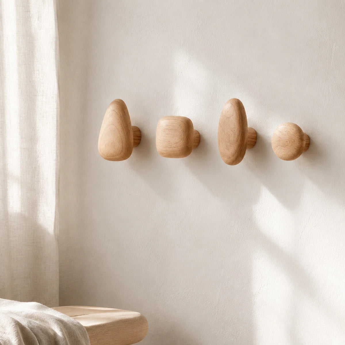 Beech Wood pebble wall hooks in a serene interior