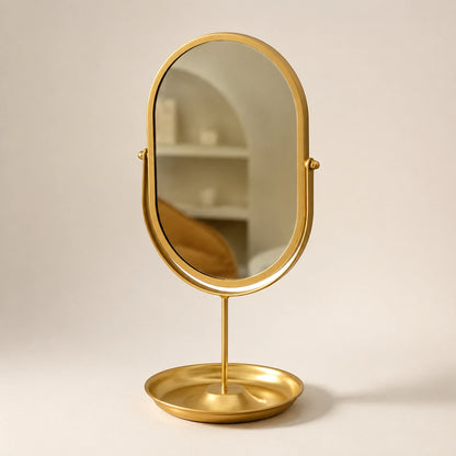 Gold oval wrought iron vanity mirror on a clean ivory background
