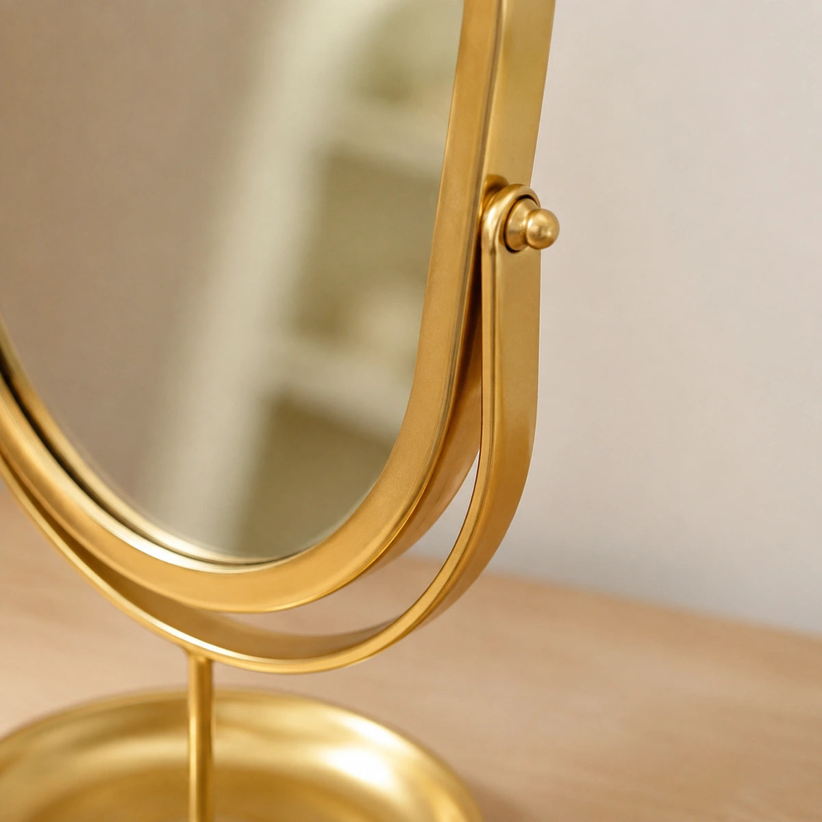 Close-up of the pivot joint and painted Gold wrought iron frame