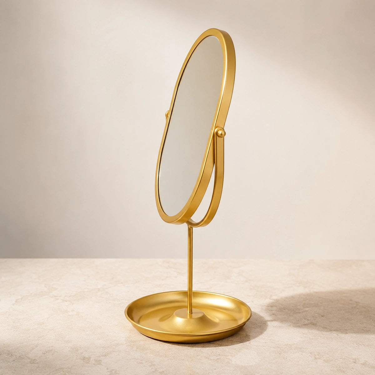 Side profile and tray base of a Gold oval vanity mirror