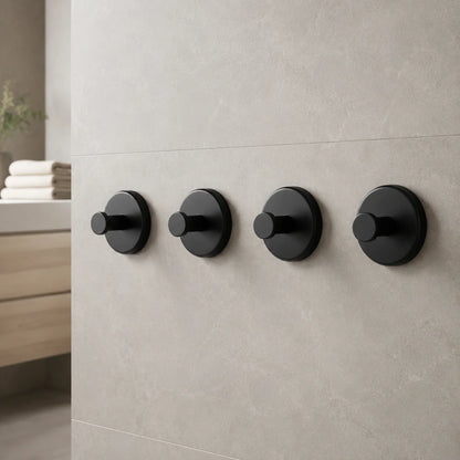 Matte Black vacuum suction wall hooks in a refined bathroom