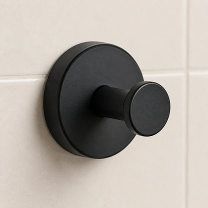 Angled view of a Matte Black suction hook with round backplate and peg