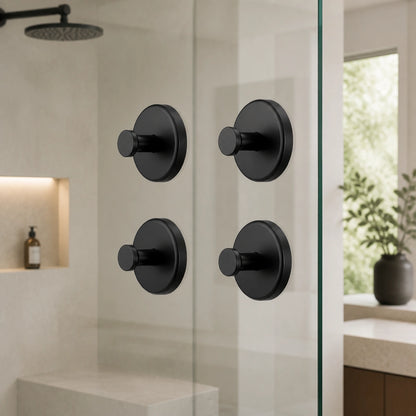 Matte Black vacuum suction hooks attached to a glass surface