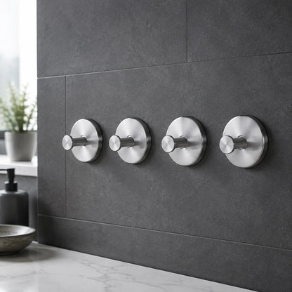 Silver vacuum suction wall hooks in a clean kitchen setting